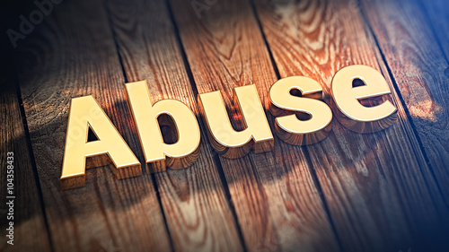 Word Abuse on wood planks photo