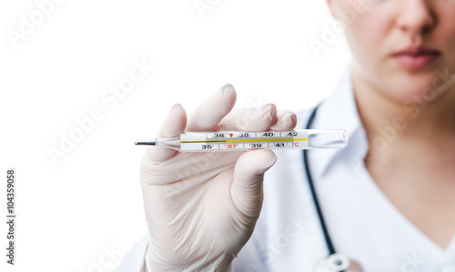 doctor holding thermometer