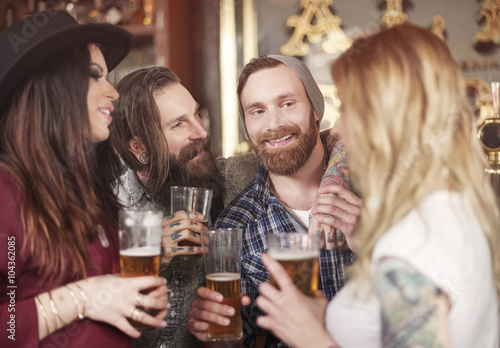 Group of best friends meeting in the pub