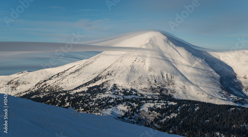 mountain top covered with gentle cloud