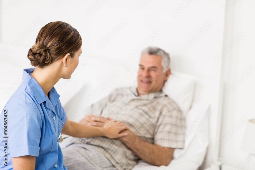 Nurse taking care of suffering senior patient Nurse taking care of suffering senior patient
