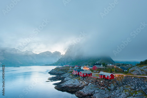 Scenic view of Reine - fishing village with red houses in the morning. Beauty of Hamnoya, Lofoten islands, Norway 
