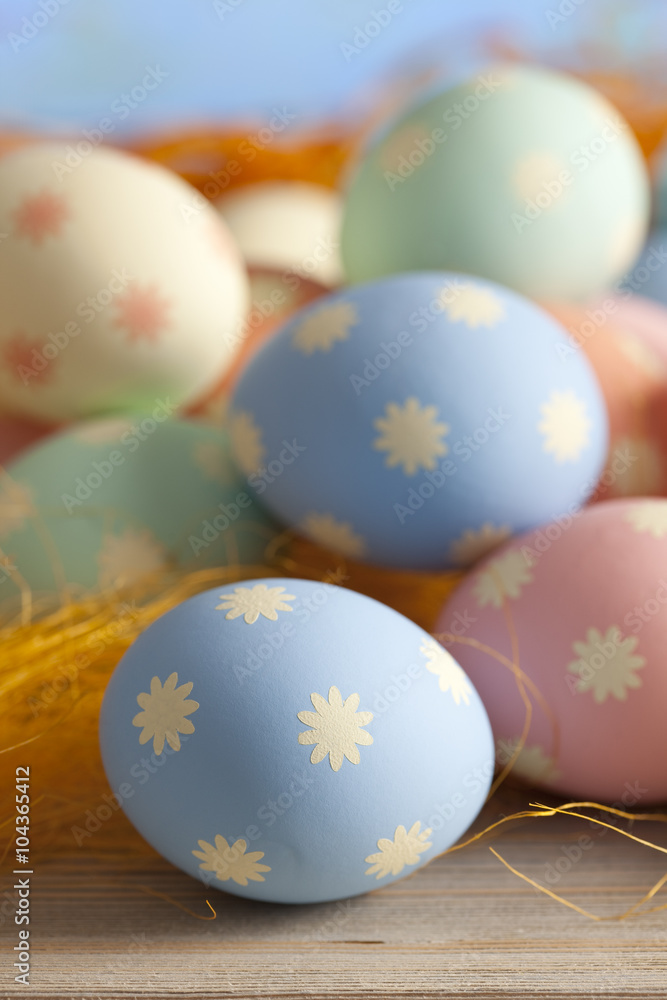 Colored Easter eggs on blue sky background