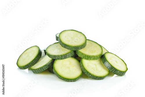 Sliced zucchini pile isolated on white