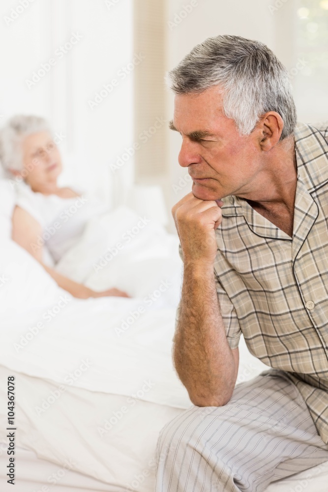 Serious senior man thinking at home Serious senior man thinking at home