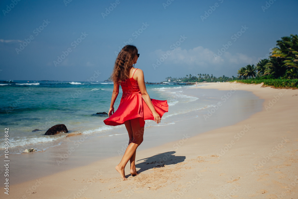 Happy woman enjoying beach relaxing joyful in summer by tropical Happy woman enjoying beach relaxing joyful in summer by tropical