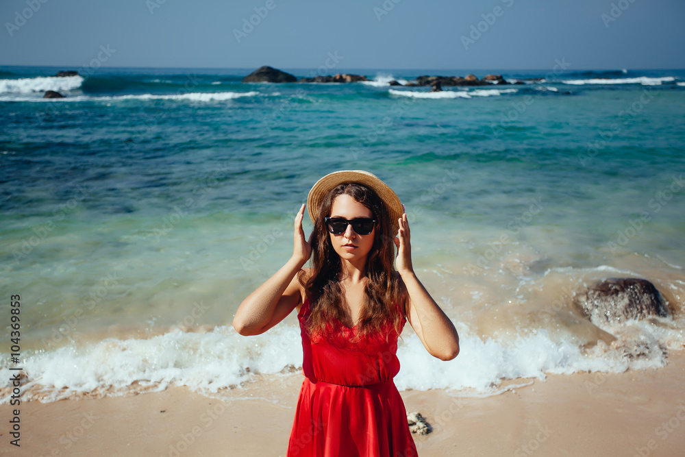 Happy woman enjoying beach relaxing joyful in summer by tropical Happy woman enjoying beach relaxing joyful in summer by tropical