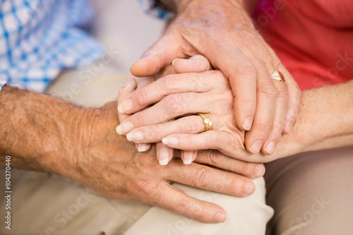 Senior couples hands together