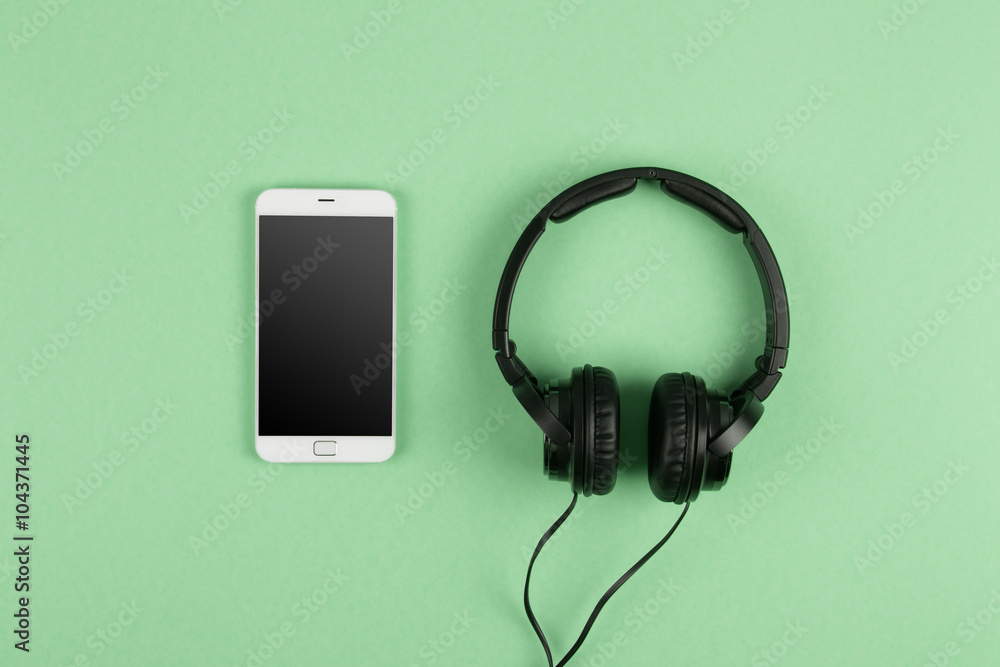 phablet and headphones on the color background phablet and headphones on the color background