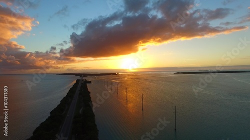 Islamorada, Florida. Aerial view of bridge across the sea at dusk photo