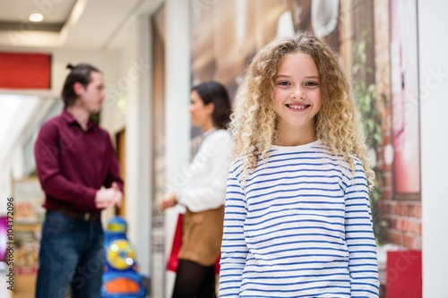 Portrait of happy girl in mall