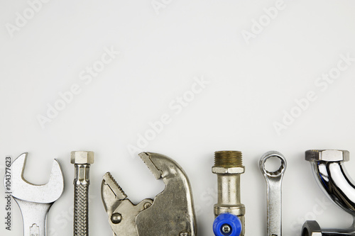 Fotografija set of plumber tools / overhead of an essential tool kit for plumber
