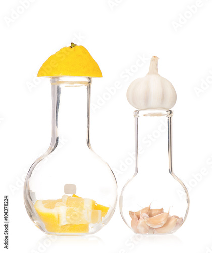 Test tubes with colorful pills slice lemon and garlic