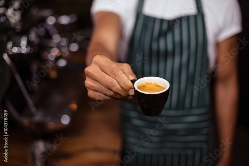 Obraz na plátně Barista offering an espresso