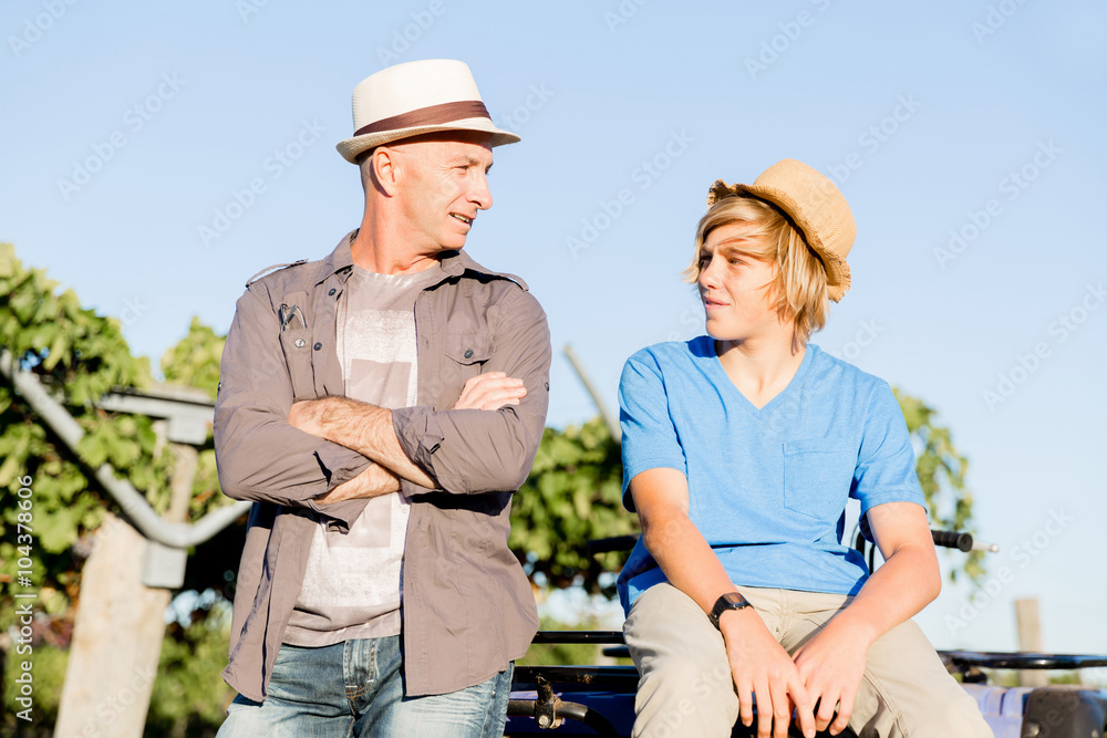 Fototapeta premium Father and son in vineyard
