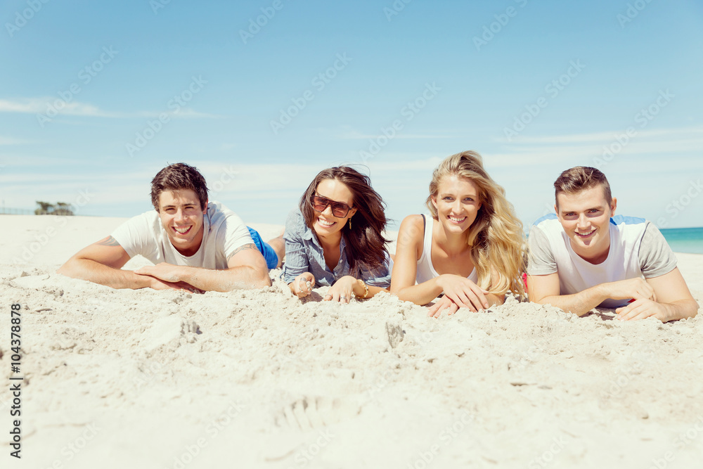 Company of young people on the beach Company of young people on the beach