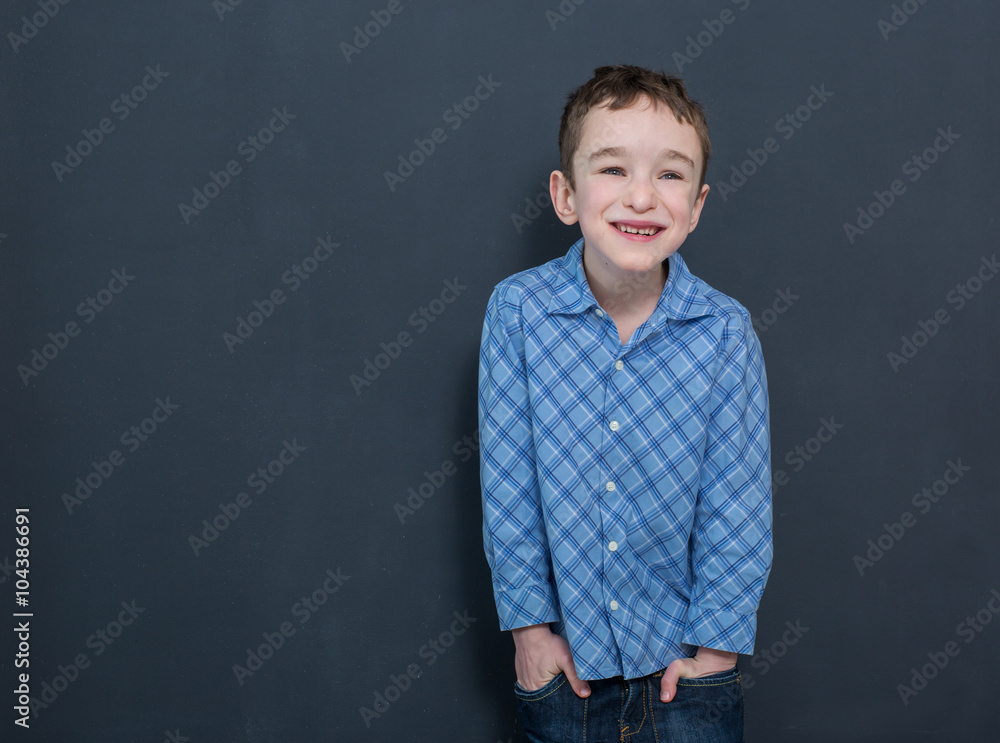 Cheerful smiling child at the blackboard
Cheerful smiling child at the blackboard