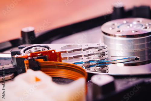 Internal hard disk closeup on wooden background