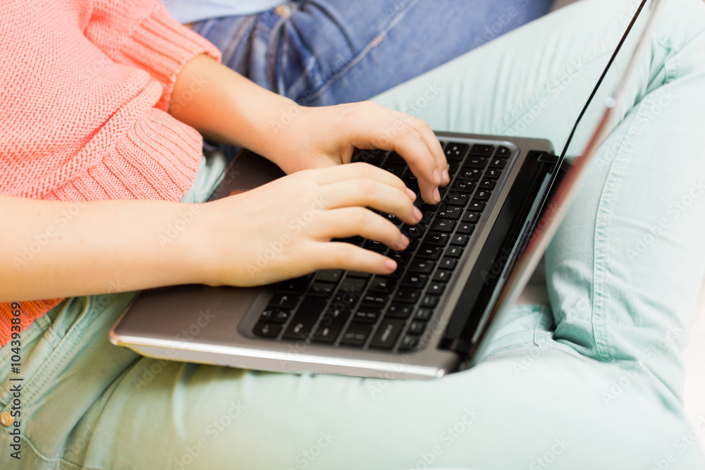 close up of women or friends with laptop at home close up of women or friends with laptop at home