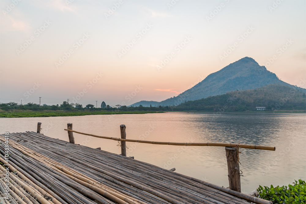 Wooden jetty on a mountain lake on morning