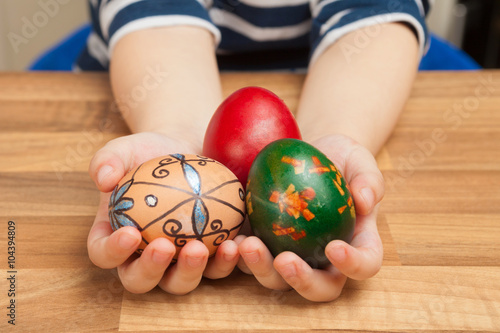 Easter eggs in hands of a child.