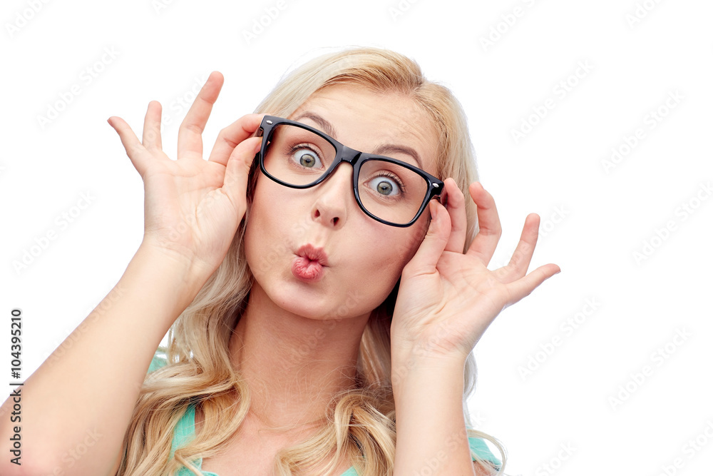 happy young woman in glasses making fish face
