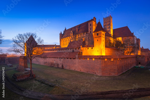 The Castle of the Teutonic Order in Malbork at dusk, Poland