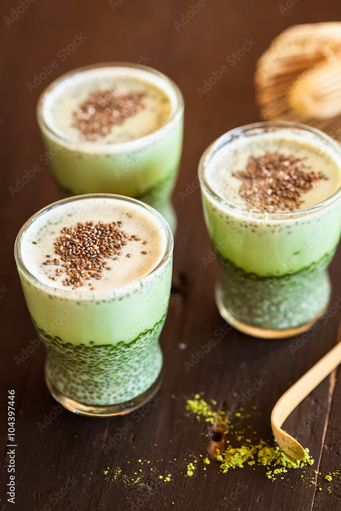 Matcha green tea chia pudding in blac wooden table Matcha green tea chia pudding in blac wooden table