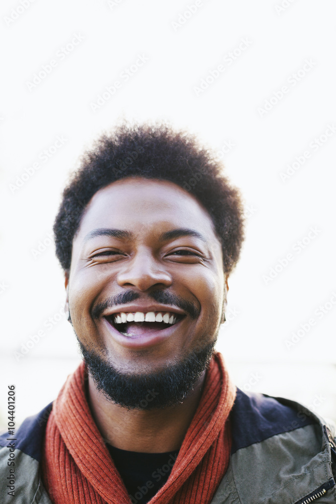 Portrait of laughing young man with Portrait of laughing young man with