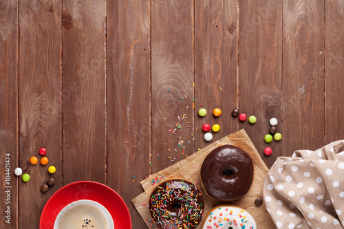 Donuts and coffee on wood