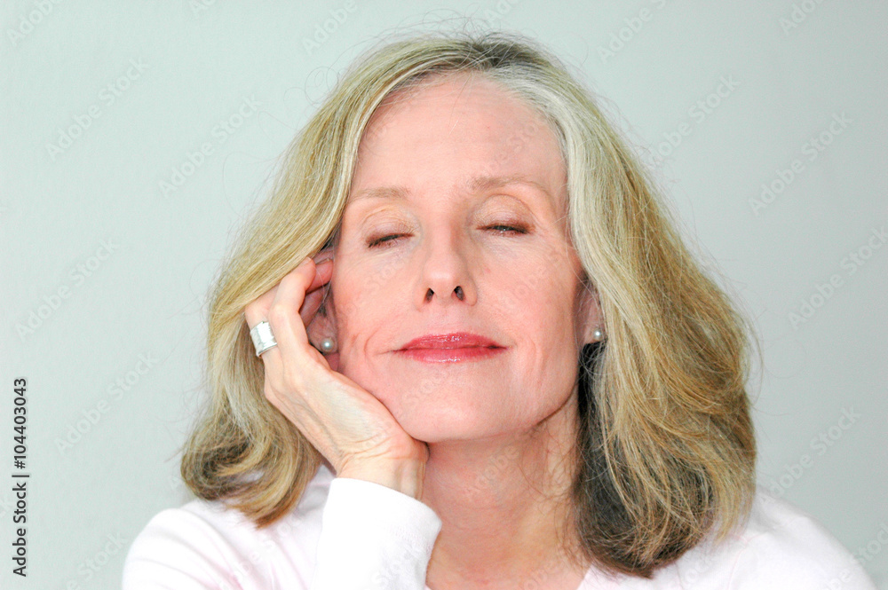 Mature female blond beauty expressions indoors. Mature female blond beauty expressions indoors.