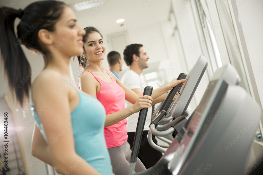 Young people training in the gym Young people training in the gym