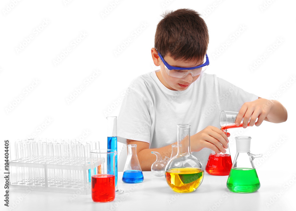 Clever little boy doing a chemical experiments, isolated on white Clever little boy doing a chemical experiments, isolated on white