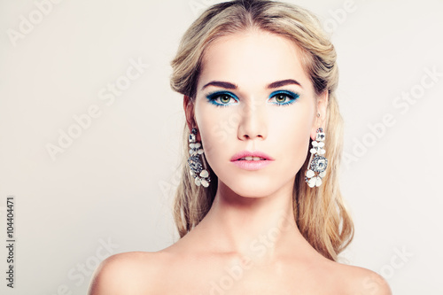Female Face. Beautiful Fashion Model Woman with Blonde Hair