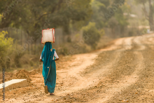 Womna with bag on head. photo