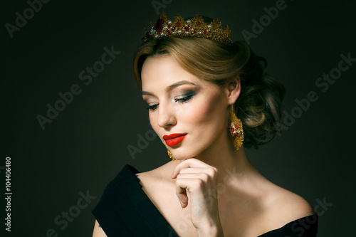 Beautiful blonde girl with a golden crown