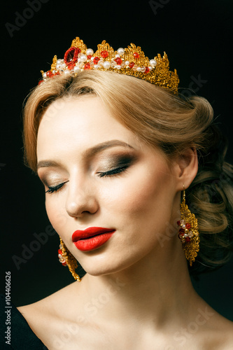 Beautiful blonde girl with a golden crown