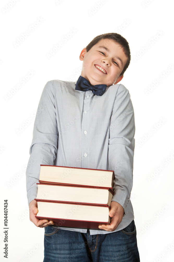 Portrait of a happy young boy, child, laughing, holding three re Portrait of a happy young boy, child, laughing, holding three re