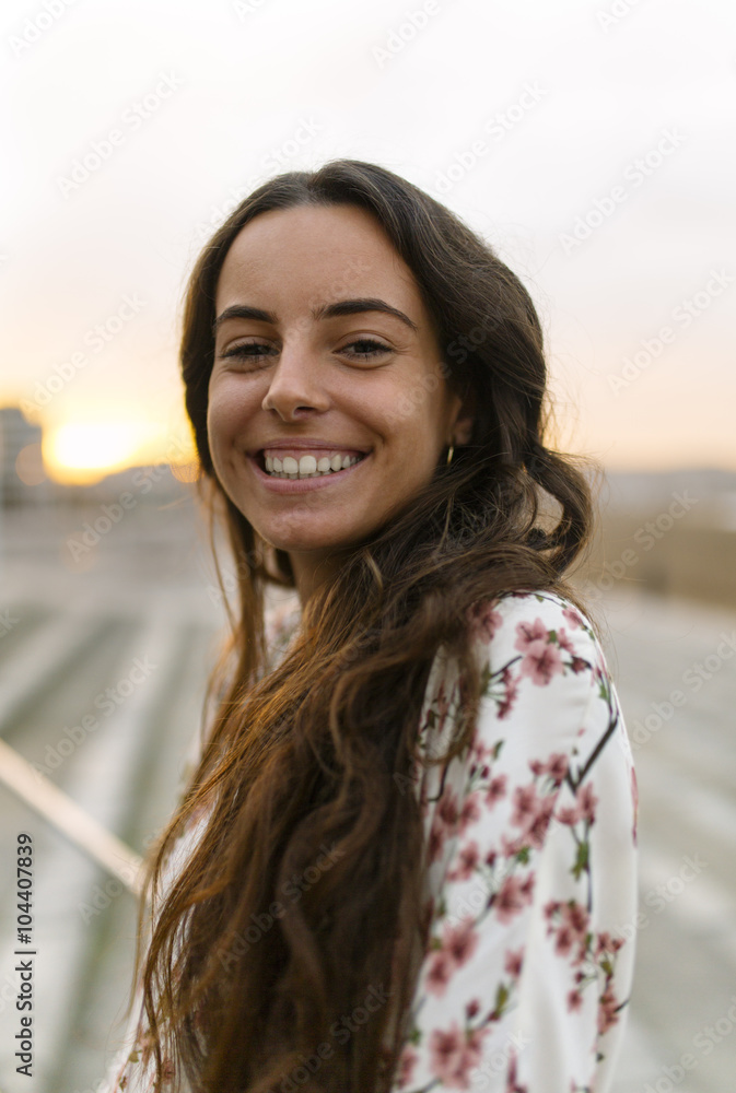 Portrait of smiling woman at evening twilight Portrait of smiling woman at evening twilight