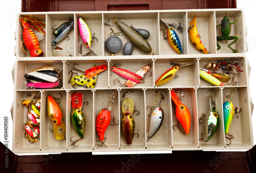 Fisherman's colourful lures in a old tackle box