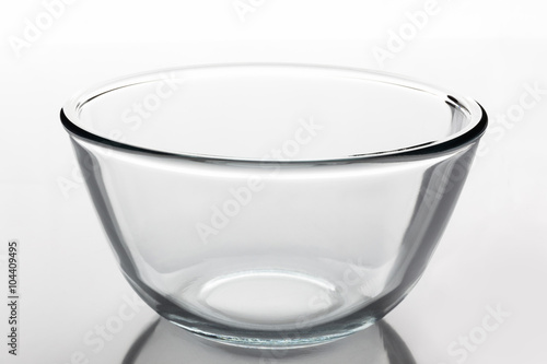 Glass transparent bowl on white background from side