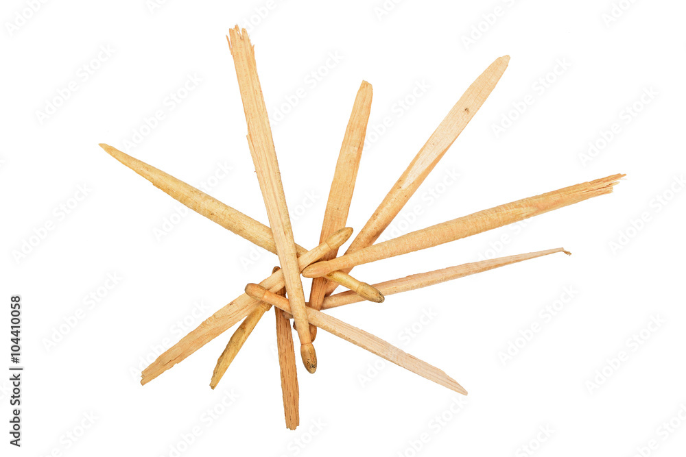 Pieces of broken wooden drumsticks isolated on white Pieces of broken wooden drumsticks isolated on white