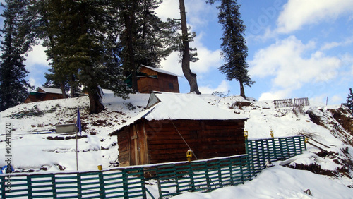 Scenic view of a snow-covered forest rest house, Narkanda, Shimla, Himachal Pradesh, India, Asia. photo