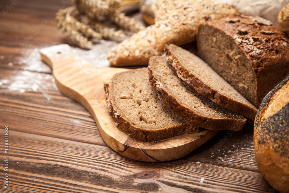 Bread assortment on wooden surface Bread assortment on wooden surface