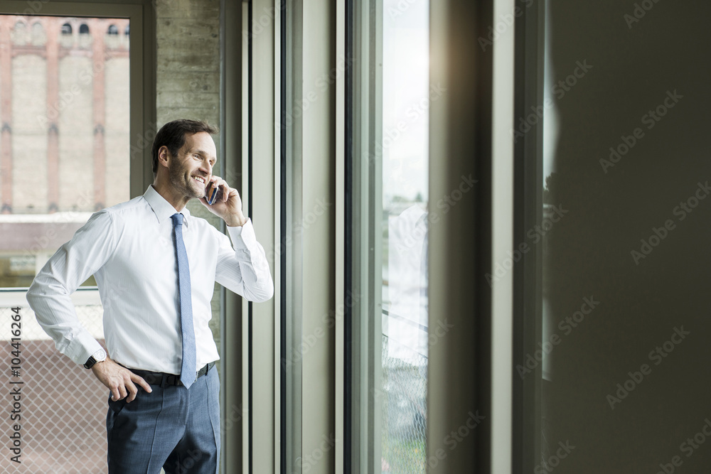 Portrait of businessman telephoning smartphone Portrait of businessman telephoning smartphone