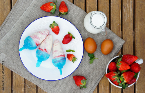 ice cream pops andmade with strawberry photo