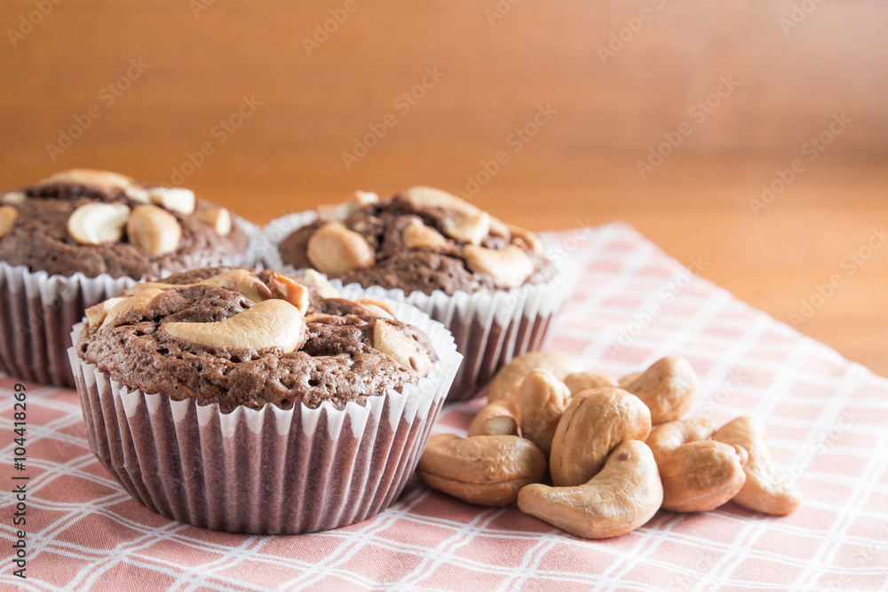 Cup of Brownies With Cashew nuts On Wooden Background