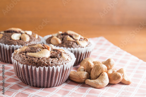 Cup of Brownies With Cashew nuts On Wooden Background