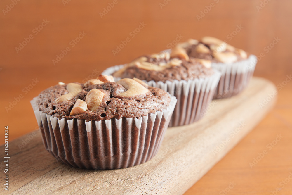 Cup of Brownies With Cashew nuts On Wooden Background
