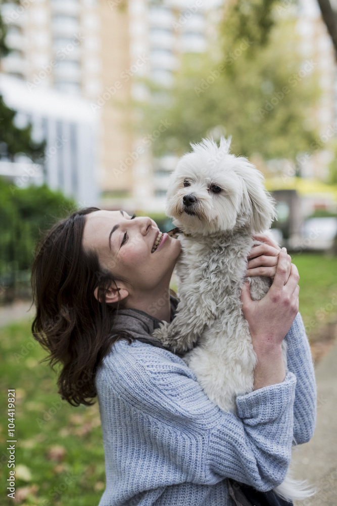 UK, London, happy young woman with her dog UK, London, happy young woman with her dog
